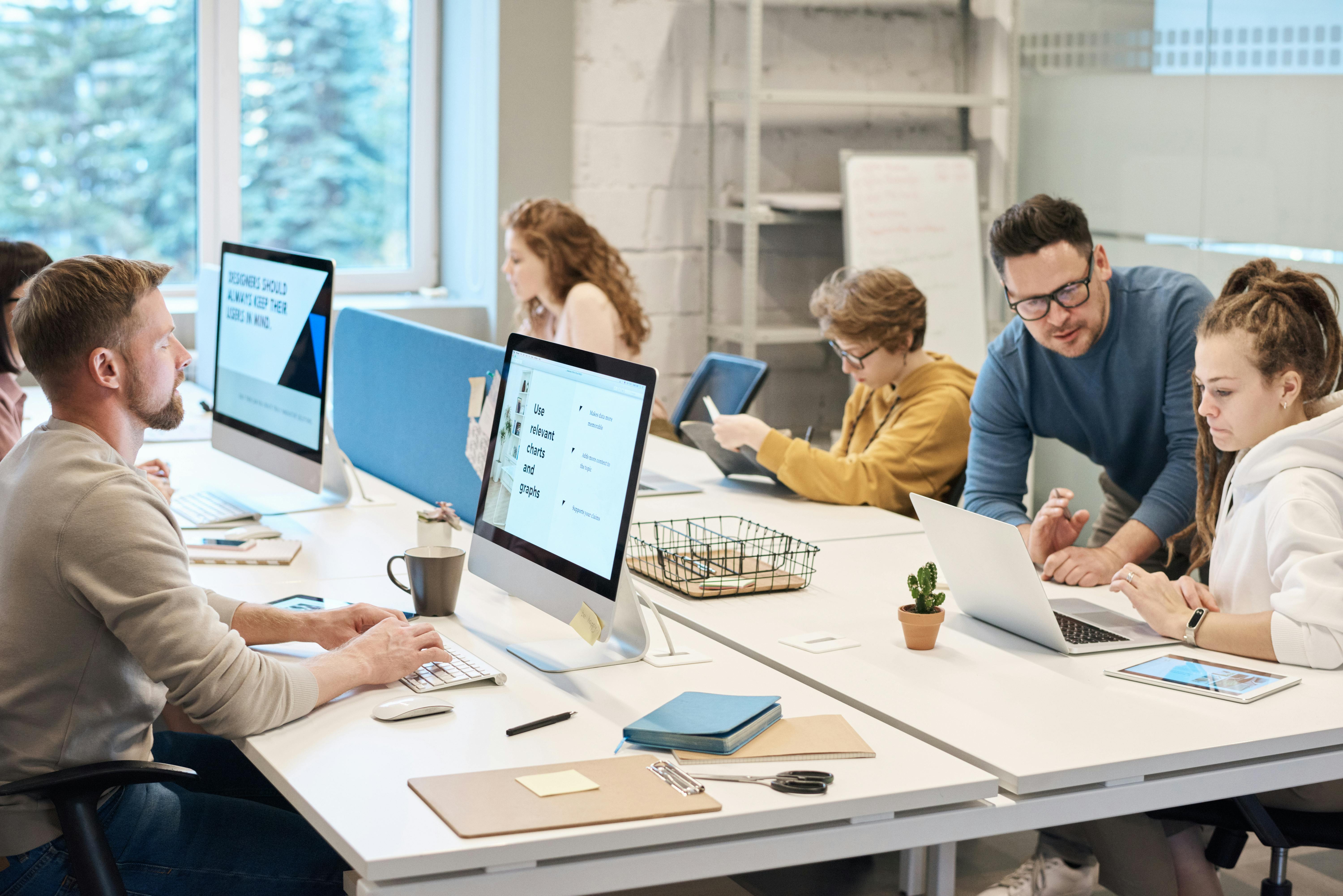 People working on a table in an office
